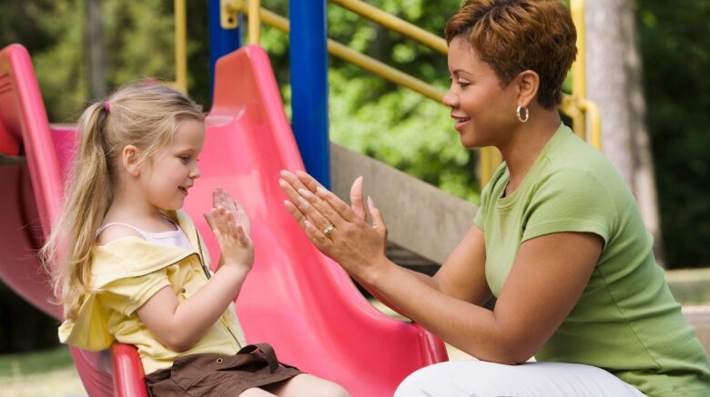 Woman playing with child